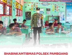Bhabinkamtibmas Polsek Pamboang Dampingi Distribusi Makanan Bergizi Gratis di SDN 18 Bababulo